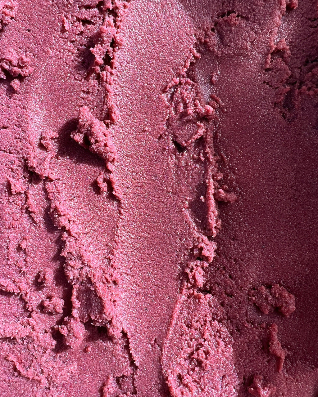 Close-up of the pinkish-purple texture of the Bruny Island Sand Exfoliating Scrub - Pink Lemonade 