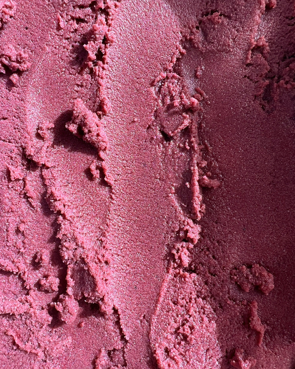 Close-up of the pinkish-purple texture of the Bruny Island Sand Exfoliating Scrub - Pink Lemonade 